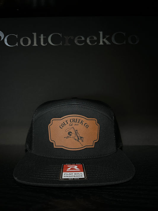Buckin’ Bronco Colt Creek Co. Black Leather Patch Flat Bill