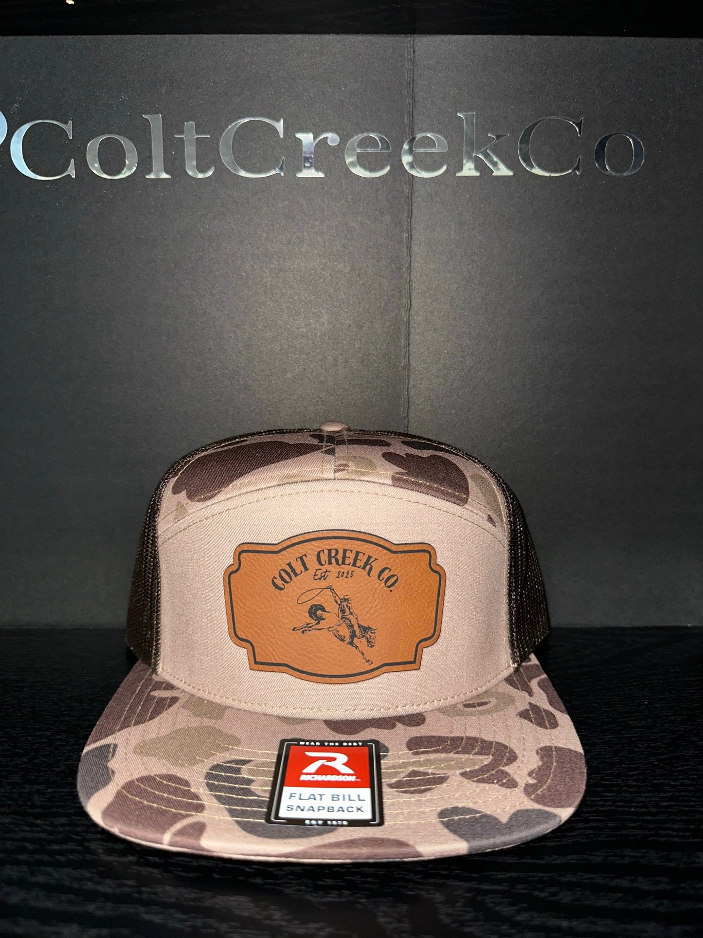 Buckin’ Bronco Colt Creek Co. Bark Camo Leather Patch Flat Bill